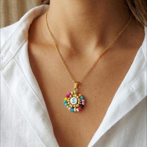 May include: A set of three ceramic mugs with a speckled, matte finish. The mugs are in shades of cream, light gray, and dark gray. Each mug has a simple, minimalist design, perfect for coffee or tea.