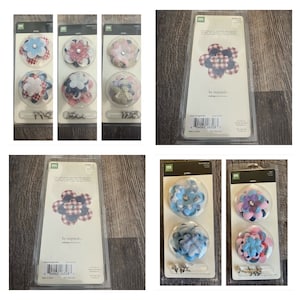 Puede incluir: Un conjunto de seis adornos florales decorativos con una variedad de colores y patrones. Los adornos están empaquetados en tarjetas con las palabras "be inspired" y "petals" impresas en ellas.