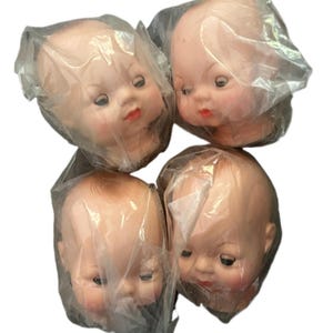 Vintage baby doll head face.  New old stock.  Blinking eyes. Head approximately 4”. HEAD ONLY!