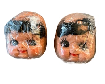 Vintage doll face. New old pre owned stock.  Brown hair big eyes, lashes. Approximately 4 1/4”
