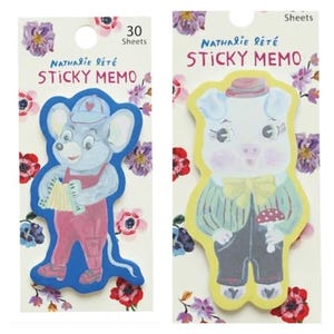 May include: Two packs of Nathalie Leté sticky memos with 30 sheets each. The left pack features a blue mouse playing an accordion, while the right pack shows a pig wearing a hat and bow tie holding a mushroom. Both have floral backgrounds.