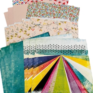 May include: A selection of patterned scrapbook paper with diverse designs. Patterns include triangles, watermelons, floral, and bird branches. The colour palette is varied, with pink, teal, yellow, and rainbow designs. The paper is from American Crafts.