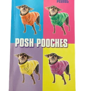 May include: A book cover with the title "POSH POOCHES" and the text "12 knitting patterns for the well-dressed dog." The cover features four images of a small dog wearing knitted sweaters in orange, green, yellow, and pink.