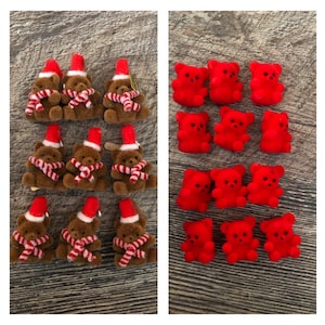 May include: Two sets of brown and red teddy bear ornaments. The first set has 12 brown teddy bears wearing Santa hats and red and white candy cane scarves. The second set has 12 red teddy bears wearing Santa hats.
