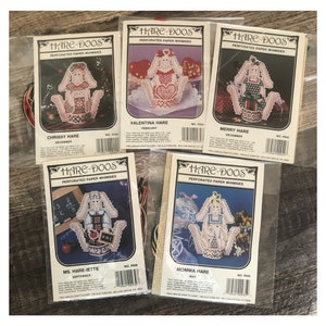 May include: Five different perforated paper craft kits featuring whimsical bunny designs. Each kit includes a pattern for a bunny with a different theme, such as "Chrissy Hare" and "Momma Hare".
