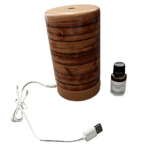 May include: A white ceramic mug with a black handle and the text "But First, Coffee" in a handwritten style. The mug is on a white surface. The mug is 10 cm tall.