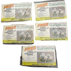 May include: Five brown paper bags with white text and images. Each bag advertises a free crewel embroidery kit with the purchase of a carton of Salem Super King cigarettes. The bags feature a daisy design and the text "Free Crew Embroidery Kit "Daisy" by Sew Simple, Inc."