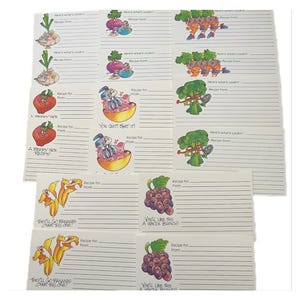 1987年製ヴィンテージの二つ折りレシピカード。野菜の漫画イラスト入り。中古未使用。16枚、8種類の異なる画像入り。