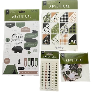 May include: A collection of scrapbooking supplies with an adventure theme. The set includes sticker sheets, patterned paper, embellishments, and die-cut shapes. The color palette features shades of green, brown, and cream, with the word "ADVENTURE" prominently displayed.