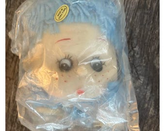 Vintage yarn doll head and hand.  blue braids Approximately 3 1/2” sweet girl face.