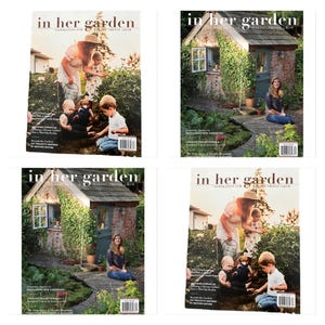 May include: Four copies of the magazine In Her Garden, featuring two distinct cover designs. Two covers show a person and children in a garden, while the other two show a person sitting outside a stone garden shed covered in green vines.