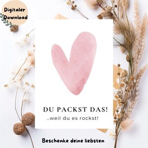 Könnte beinhalten: Digitaler Download mit einem rosa Herz im Aquarellstil auf weißem Hintergrund. Unter dem Herz steht der Text "DU PACKST DAS! ..weil du es rockst!", darunter "Beschenke deine liebsten". Oben links steht der Text "Digitaler Download".