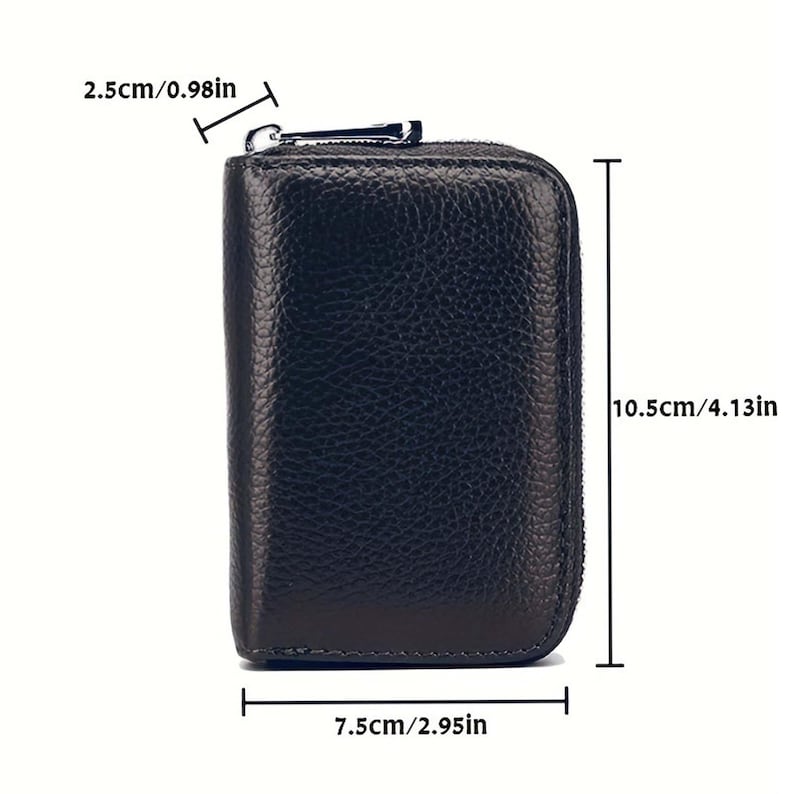 May include: Black leather zippered wallet with a textured surface. The wallet measures 7.5 inches wide, 4.13 inches tall, and 0.98 inches thick.
