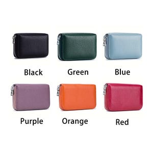 May include: Six leather wallets in different colors: black, green, blue, purple, orange, and red. Each wallet has a zipper closure and a textured surface.
