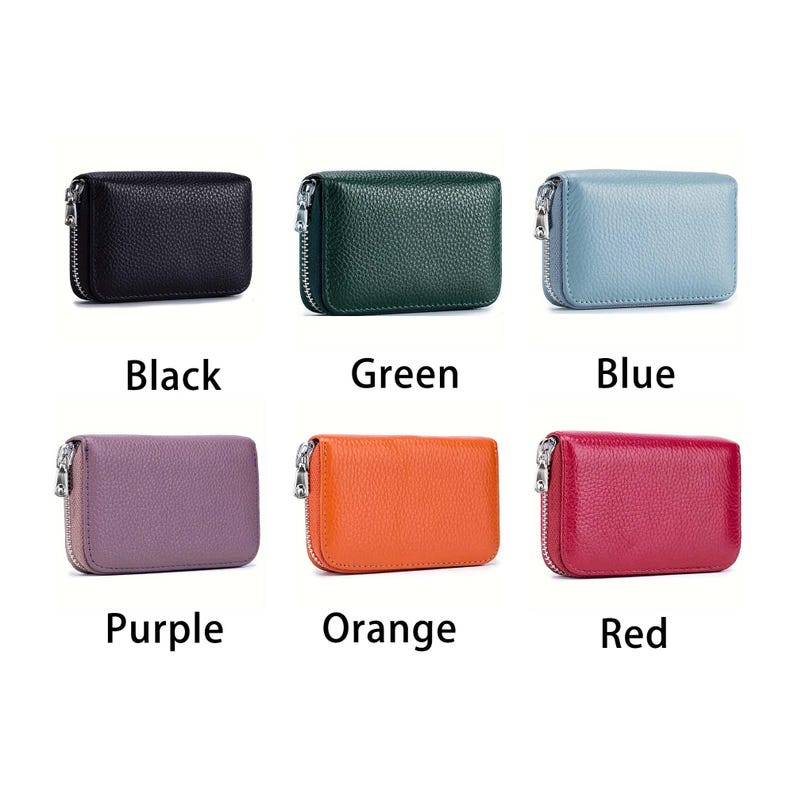 May include: Six leather wallets in different colors: black, green, blue, purple, orange, and red. Each wallet has a zipper closure and a textured surface.