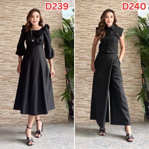 May include: Two black outfits are displayed. The first is a long-sleeved midi dress with a floral accent at the neckline. The second is a sleeveless top and wide-leg pants set. Both outfits are paired with black heels.
