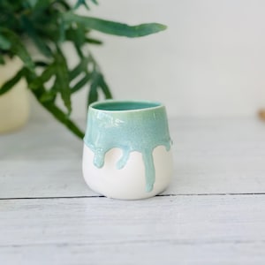 Turquoise green porcelain tumbler dimple cup.  Handleless mug.  Porcelain mug made on the potters wheel.  Drippy turquoise glaze.