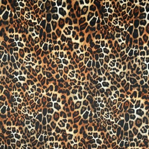 May include: A seamless pattern of brown, black and white leopard print.