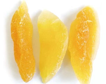 May include: Three dried mango slices, each with a different shape and size. The mango slices are a bright yellow color and have a slightly translucent appearance.