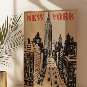 May include: A black and white illustration of the New York City skyline with the Empire State Building in the center. The text "NEW YORK" is in red at the top of the image.