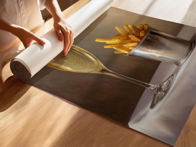 May include: A still-life painting depicts a champagne glass and a metal cup filled with french fries. The glass is filled with a bubbly liquid. The fries are golden brown. The painting is on a surface, with a roll of paper being unrolled.