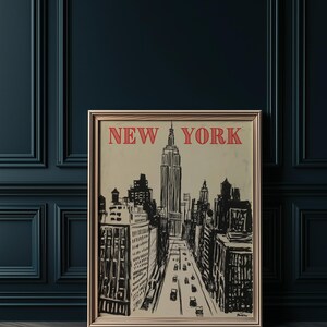 May include: A vintage-style poster with a black and white illustration of the New York City skyline, including the Empire State Building. The poster has a beige background with the words "NEW YORK" in red letters at the top.