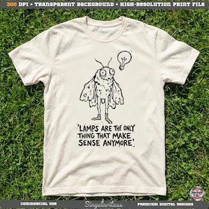 May include: Cream-colored t-shirt featuring a black illustration of a moth with an oversized head and a lightbulb. The text reads, "LAMPS ARE THE ONLY THING THAT MAKE SENSE ANYMORE." The shirt is made of a soft material.