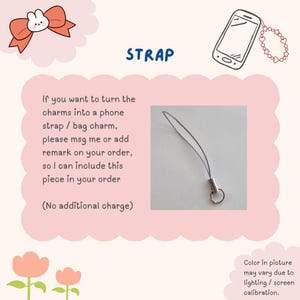 May include: A silver-colored phone strap with a metal clasp and loop. The word "STRAP" is written in blue. Text on the image explains how to request the strap for a phone or bag charm. The image has a pink cloud-like border.