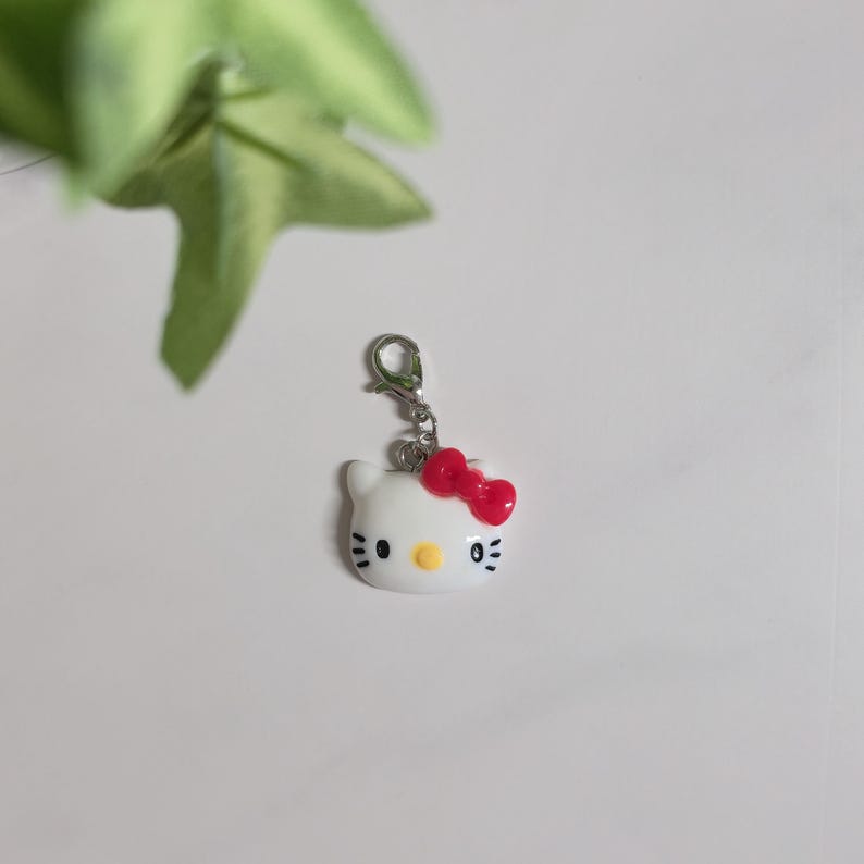 Hello Kitty Charms -Traveler's Journal/ notebook / Charm Purse Charm/ Phone charm/ bag charm - Bead / Pearl / Bow / Vintage Key charm Style B.