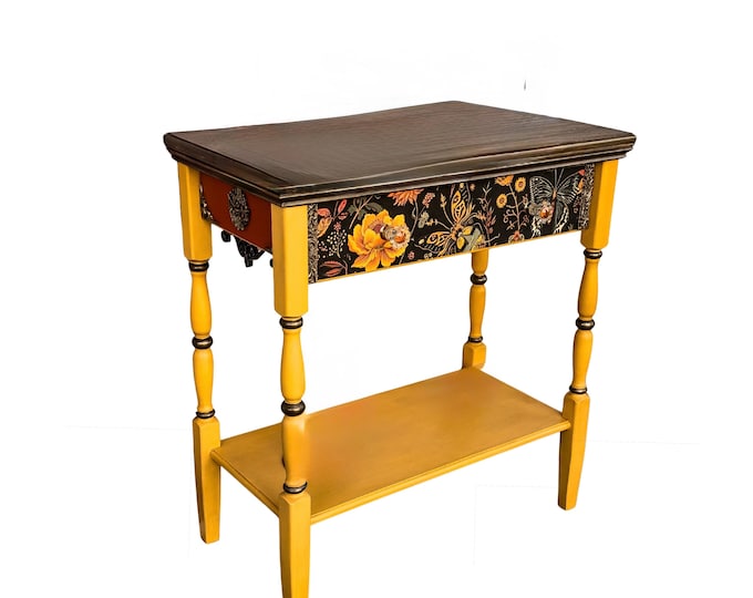 New  wooden mustard console table with a whimsical floral design on the drawer