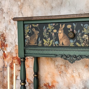 Luxury green console table, hand-painted with whimsical floral and animal motif, detailed carved legs and trim, one-of-a-kind functional art furniture piece for elegant interiors