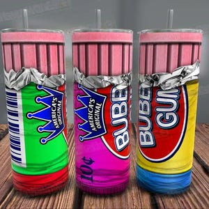 May include: Three 20 oz. stainless steel tumblers with a bubble gum design. The tumblers are wrapped in foil and have a pink, green, and blue color scheme. The text on the tumblers reads "America's Original Bubble Gum".