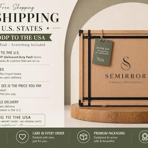 May include: A rectangular cardboard shipping box with black metal corner reinforcements and straps. The box features the Semirror logo, a green thank you tag, and fragile handling labels. It sits on a circular wooden base.