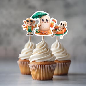 May include: Three cupcakes with different Halloween themed toppers. The first cupcake has a green and white ghost holding an umbrella. The second cupcake has a goblin wearing sunglasses and holding a drink. The third cupcake has a skeleton wearing a life preserver.