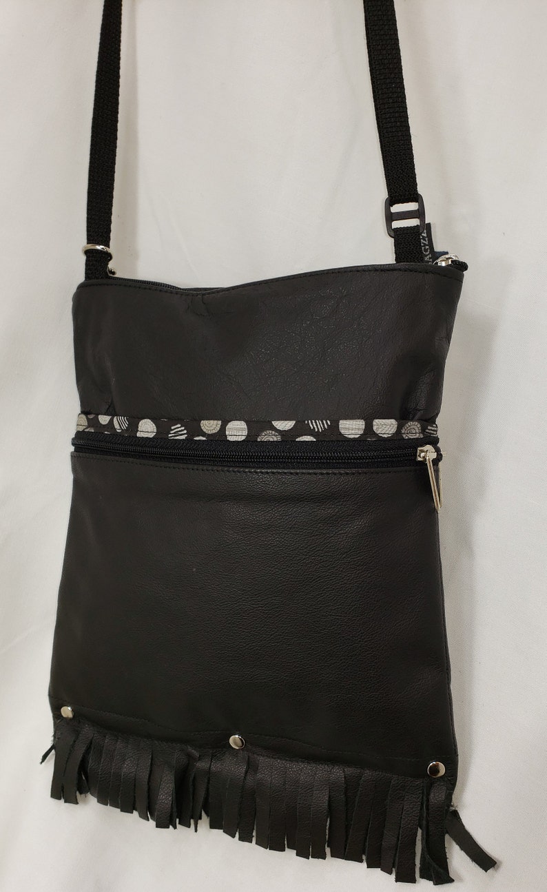 Leather Large Travel Bag that Can Convert to a Backpack Fringed Free Shipping.