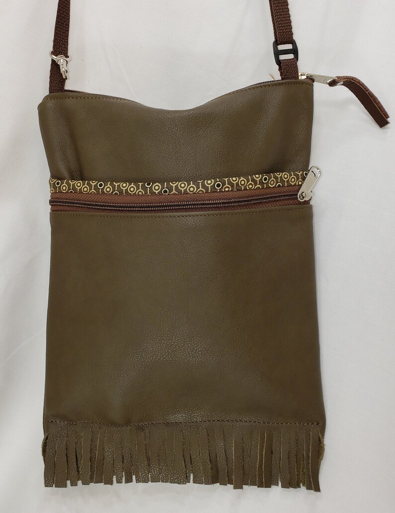 Leather Large Travel Bag that Can Convert to a Backpack Fringed Free Shipping.