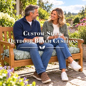 May include: A rectangular outdoor bench cushion with a sage green and white leaf pattern, featuring side ties, placed on a wooden bench. The text "Custom-Sized Outdoor Bench Cushions" is overlaid in white with a decorative leaf icon below it.