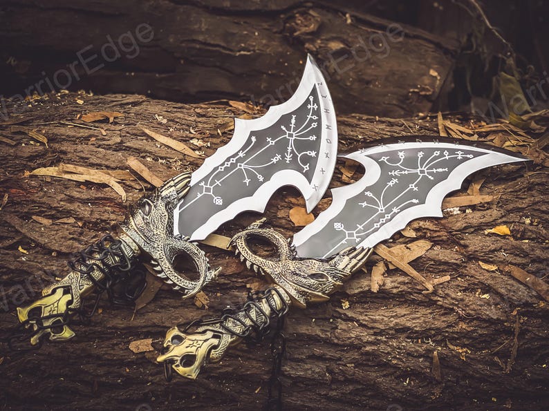 May include: Two decorative swords with black blades and gold handles. The blades have intricate designs and the handles are shaped like dragon heads.