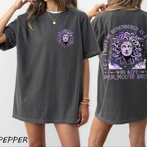 a woman wearing a t - shirt with a picture of a woman's face