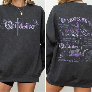 a black sweatshirt with purple writing on it