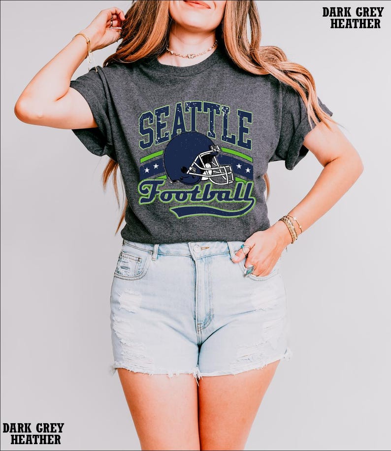 a woman wearing a seattle football t - shirt