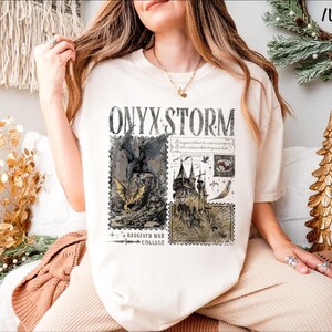 a woman sitting on a chair wearing a t - shirt