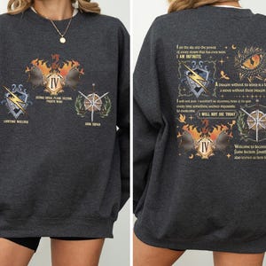 a woman wearing a sweatshirt with a graphic on it