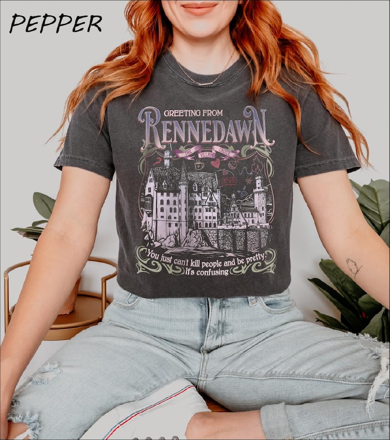 a woman sitting on a chair wearing a t - shirt