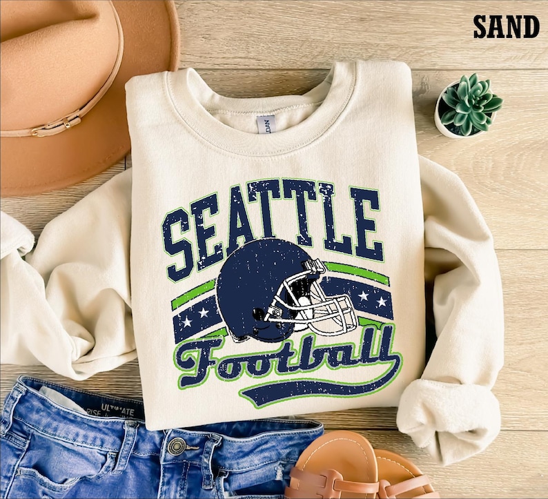 a sweater with a football helmet on it