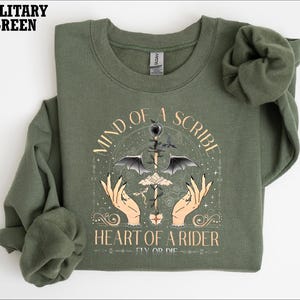 a t - shirt with a picture of a heart of a spider on it
