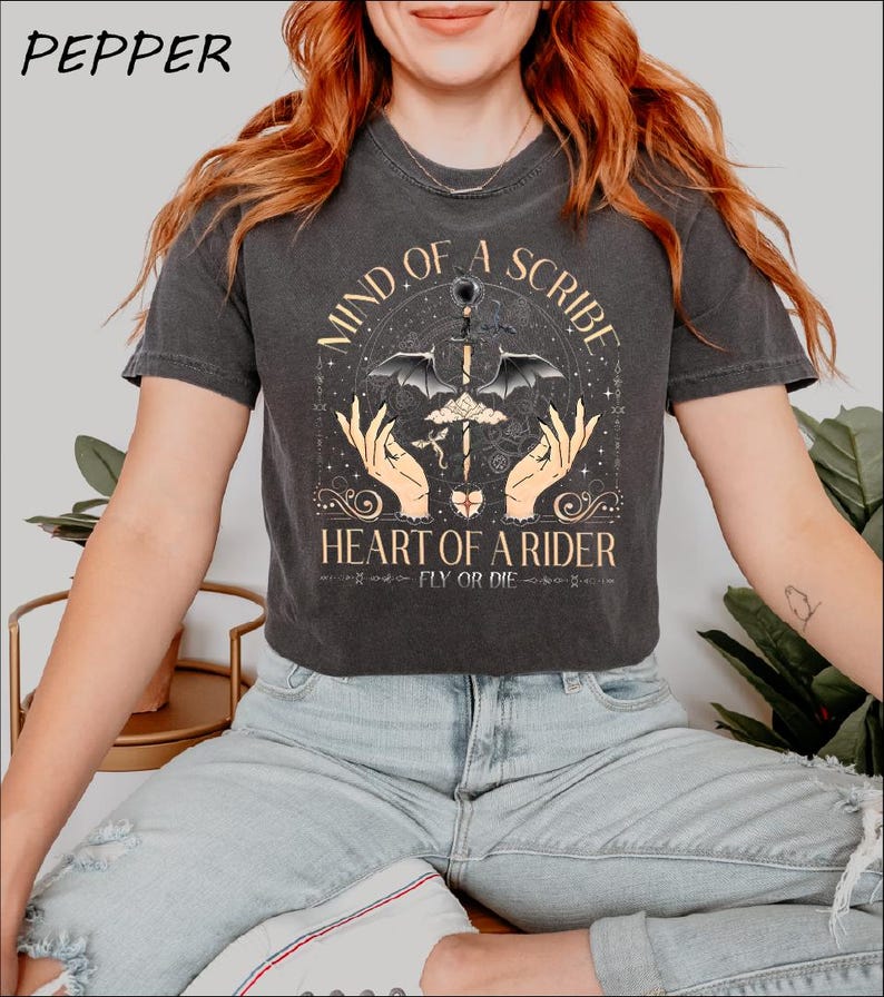 a woman wearing a t - shirt that says land of a spirit heart of a