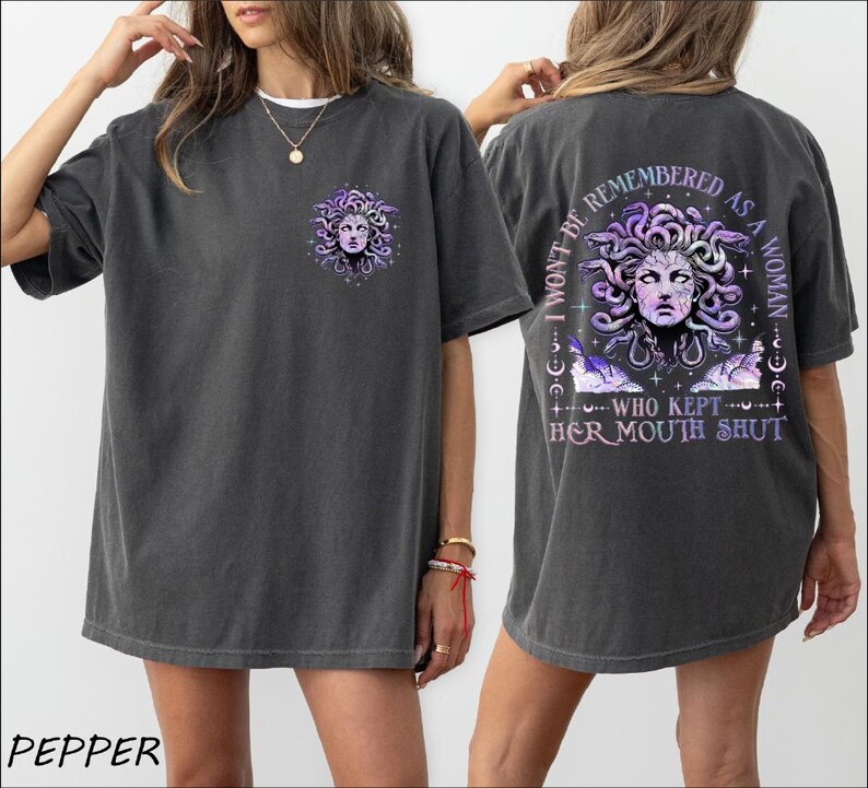 a woman wearing a t - shirt with a picture of a woman's face