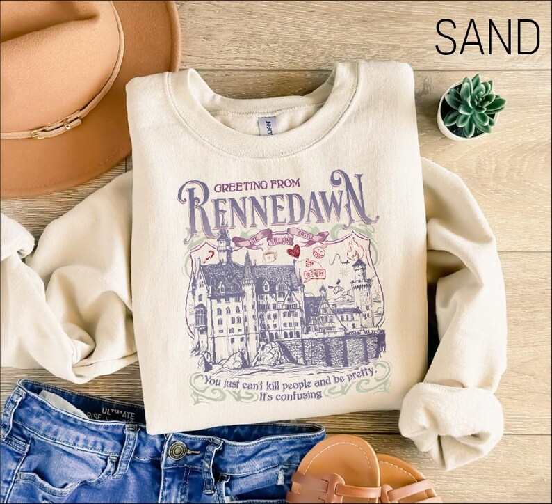 a white shirt with a picture of a castle on it