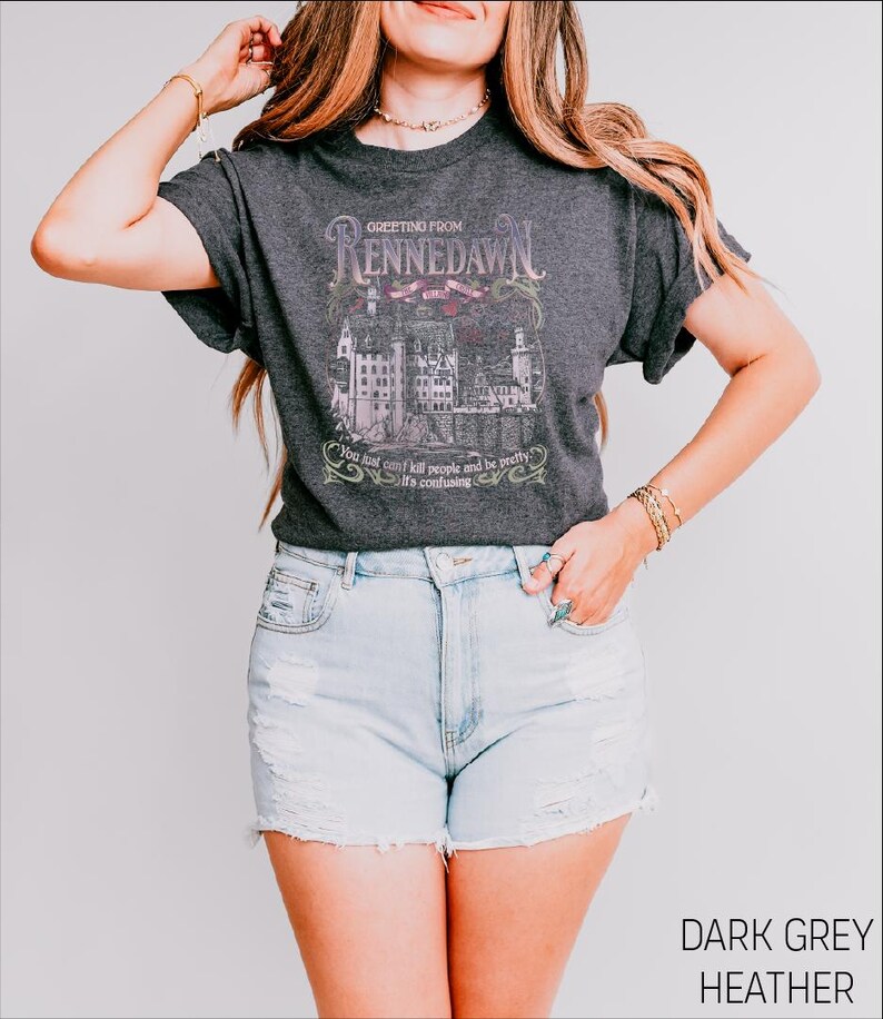 a woman wearing a black shirt and denim shorts